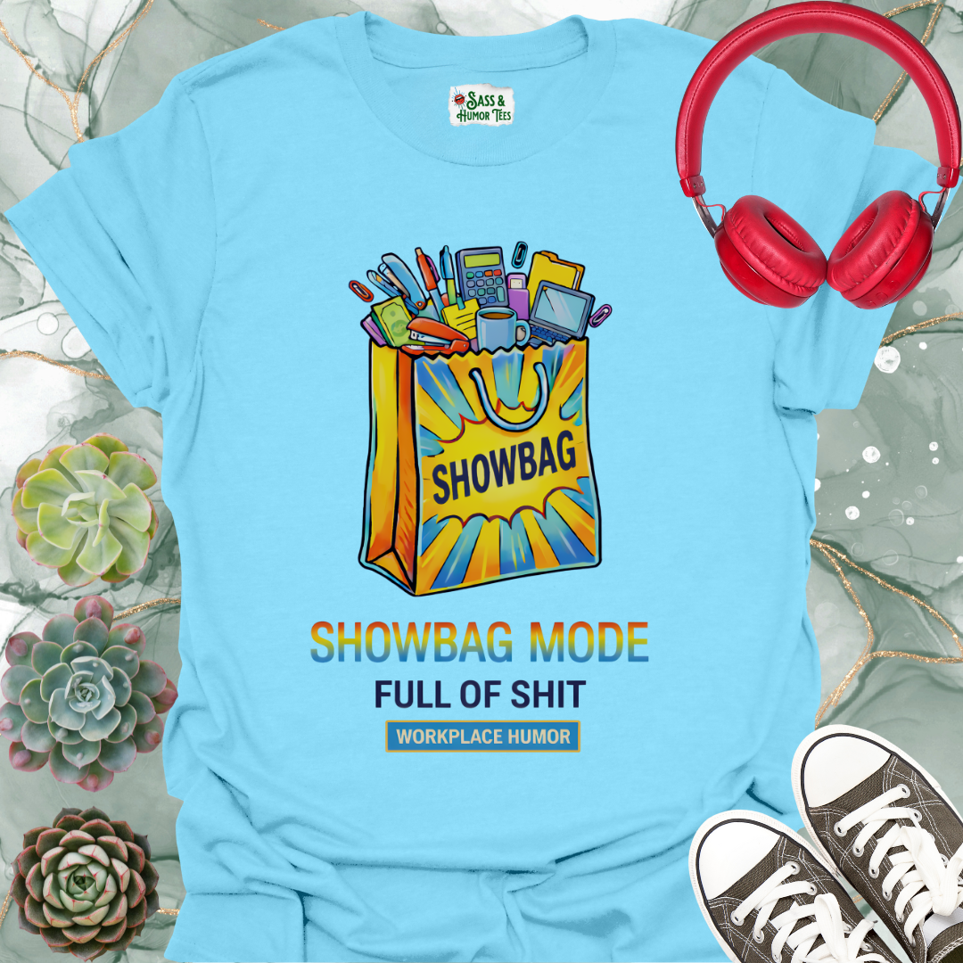 A funny workplace humor tee featuring the phrase “Showbag Mode: Full of Shit.”