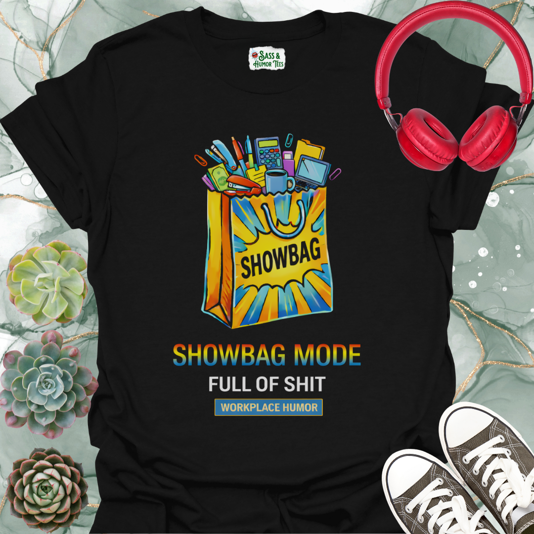 A funny workplace humor tee featuring the phrase “Showbag Mode: Full of Shit.”