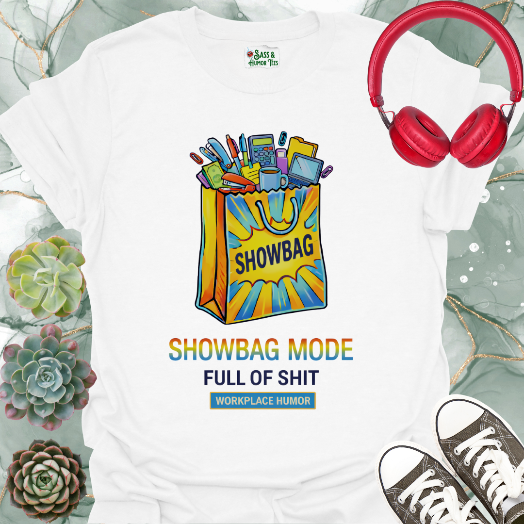 A funny workplace humor tee featuring the phrase “Showbag Mode: Full of Shit.”
