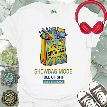A funny workplace humor tee featuring the phrase “Showbag Mode: Full of Shit.”